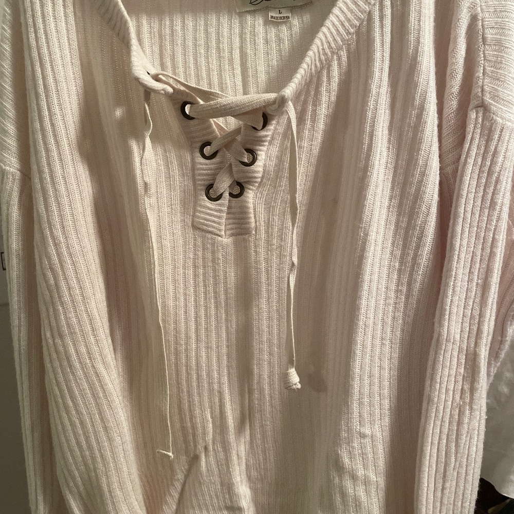 Cream colored lace up sweater